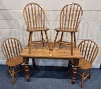 A MODERN PINE RECTANGULAR TABLE, raised on block and turned legs, width 122cm x depth 76cm x