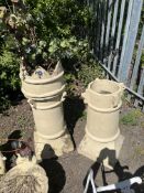 TWO VINTAGE CHIMNEY POTS, the largest with a crown top, 103cm high, the other missing spikes at