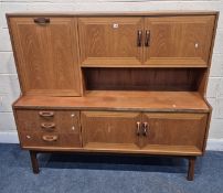 G PLAN SIERRA, A MID-CENTURY TEAK HIGHBOARD, fitted with a fall front door, two pairs of cupboard