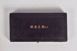 A WWI ERA MILITARY MBE BREAST BADGE IN ITS GARRARD & CO. BOX, this award is fully hallmarked and