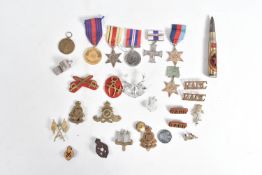 A SMALL COLLECTION OF ASSORTED MEDALS, CAP BADGES AND A WHISTLE, to include a WWII Victory medal