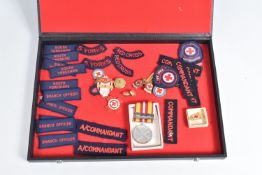 A VOLUNTARY MEDICAL SERVICE MEDAL WITH A COLLECTION OF CLOTH SHOULDER TITLES AND VARIOUS BADGES, the