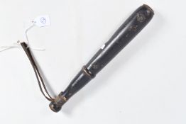 A TURNED WOODEN TRUNCHEON OR BILLY CLUB, this has a leather wrist strap, the remnants of binding
