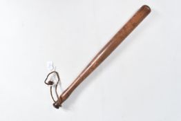 A TURNED WOODEN TRUNCHEON WITH A LEATHER WRIST STRAP, this has a plain and smooth handle and