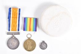 A PAIR OF WWI MEDALS AND A SMALL WHITE METAL TRIBUTE MEDAL, the medals are correctly impressed 55354