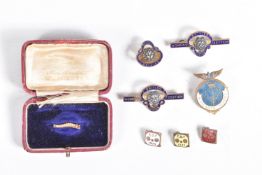 A VINTAGE CATERPILLAR CLUB BADGE AND A SMALL ASSORTMENT OF LAPEL PINS, this caterpillar club