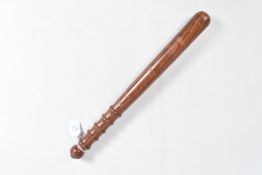A TURNED WOODEN TRUNCHEON USUALLY CARRIED BY POLICE OFFICERS, this has a ribbed handle and plain