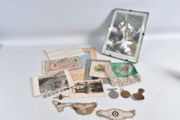 AN ASSORTMENT OF MILITARY ITEMS FROM WWI AND WWII, such as medals, photos, banknotes and cloth