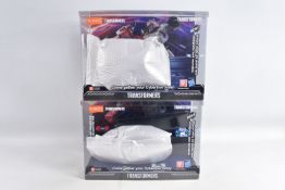 TWO 2024 HASBRO BLOKEES FIGURES TRANSFORMERS DISPLAY CASES, each has a bag inside containing