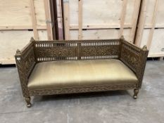 A LATE 20TH CENTURY INDIAN STYLE GILTWOOD DAY BED, carved with foliage decoration throughout, and