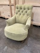 A LATE 20TH CENTURY LIME GREEN UPHOLSTERED ARMCHAIR, on oak legs, and brass caster, width 73cm x