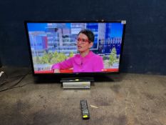 A BUSH DLED32165HDY 32in TV with remote (PAT pass and working) and a Tesco DVD player (doesn't
