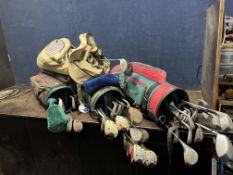 FOUR GOLF BAGS CONTAINING CLUBS, including a Taylor Made r7 draw, Ping Eye 2 woods 1, 3, 5, and 7,