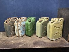FIVE TWENTY LITRE 'JERRY' CANS including two stamped WD. 1952 (5) Condition Report: rusty, dented