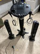 A THE SINGING MACHINE iSM1028X KARAOKE MACHINE with two microphones and two satellite speakers (