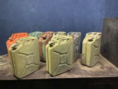EIGHT TWENTY LITRE 'JERRY' CANS including three stamped WD. and dated 1952 and two 1996 (8)