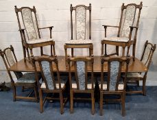 LUCIAN ERCOLANI, AN ERCOL ELM AND BEECH EXTENDING DINING TABLE, with three additional leaves, raised