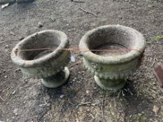 A PAIR OF CONCRETE GARDEN URNS, 38cm in diameter, with rose bosses and fluted bowls, Condition