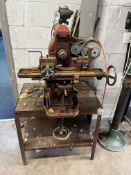 A VINTAGE UNBRANDED MILLING MACHINE, on stand, with motor, pulleys and belt, total height 138cm,