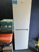 A BEKO CJFF1582W FRIDGE FREEZER, width 55cm, depth 60cm, height 182cm (PAT pass and working at 3 and