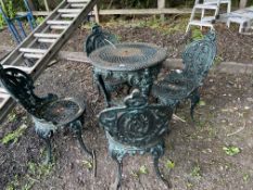 A CAST IRON 'BRITANNIA' PUB TABLE WITH A SET OF FOUR CAST IRON CHAIRS, table has 61cm cast iron
