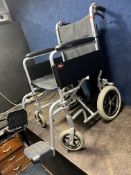 AN ENIGMA FOLDING WHEELCHAIR with two footrests