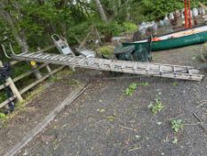 A 'GRAVITY' ALUMINIUM DOUBLE EXTENSION LADDER, with 17 rungs to each 450cm length, with a wheeled