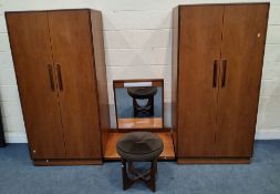 A MID-CENTURY G PLAN FRESCO TEAK BEDROOM FITMENT, comprising a pair of double door wardrobes,