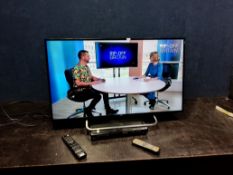 A JVC LT-40C590 40in SMART TV with remote and a DVD player with remote (both PAT pass and