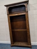 AN ART NOUVEAU OAK HALL STAND, with a top storage section, over a larger section with seven hooks,