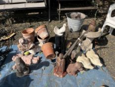 A COLLECTION OF GARDEN ORNAMENTS, including concrete pigs, dogs, otters, bird bath, a metal bird