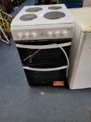 AN INDESIT ELECTRIC COOKER with four rings to top, grill and oven, width 50cm, depth 65cm, height