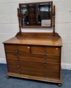 AN EARLY 20TH CENTURY DRESSING CHEST, with a single bevelled edge mirror, atop a base with two short