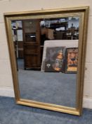 A GILT WOOD RECTANGULAR BEVELLED EDGE WALL MIRROR, 117cm x 91cm, condition report: no visible