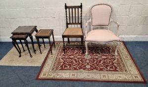 A RED GROUND RECTANGULAR WOOLLEN RUG, 171cm x 120cm, a smaller rug, two chairs, a nest of two