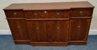 A BERESFORD AND HICKS REPRODUCTION YEW WOOD BREAKFRONT SIDEBOARD, fitted with four drawers, one