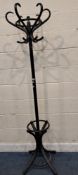 AN EBONISED COAT / HAT STAND, the revolving top with six branches, height 194cm, condition report:
