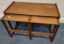 ARNE HOVMAND-OLSEN FOR MOGENS KOLD, A DANISH MID-CENTURY TEAK NEST OF THREE TABLES, largest table