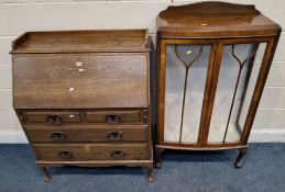 AN EARLY 20TH CENTURY OAK BUREAU, with a later raised gallery, the fall front door enclosing a