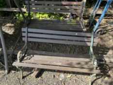 A PAIR OF CAST IRON AND WOODEN SLATTED GARDEN BENCHES, both 122cm wide, with scrolled detail to