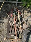 A COLLECTION OF GARDEN TOOLS, including hoes, shovels, pick axes, spades, clippers, etc (10+)