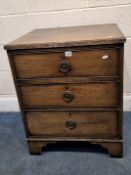 A 19TH CENTURY MAHOGANY CHEST OF THREE GRADUATED DRAWERS, raised on bracket feet, width 60cm x depth