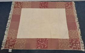 A LAURA ASHLEY HOME FLORENCE RUG, with a cream centre, surrounded by a patchwork style border, 190cm