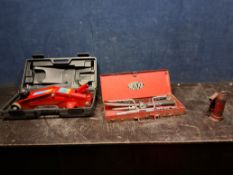 A CASED HILKA 2 TONNE HYDRAULIC TROLLEY JACK with handle, a Britool socket set case with various