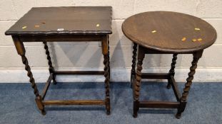 AN EARLY 20TH CENTURY OAK TABLE, with a wavy edge, raised on barley twist legs, united by