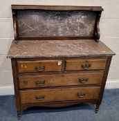 AN EARLY 20TH CENTURY WALNUT MARBLE TOP WASH STAND, with a raised back, fitted with two short over