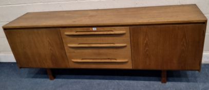 A MID-CENTURY DANISH TEAK SIDEBOARD, fitted with two cupboard doors, flanking three drawers, the top