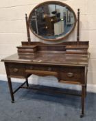 CHRISTOPHER PRATT AND SONS, AN EDWARDIAN MAHOGANY DRESSING TABLE, with an oval bevelled edge