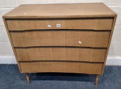 A 20TH CENTURY OAK AVALON YATTON CHEST OF FOUR DRAWERS, raised on cylindrical tapered legs, width