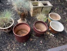 A COLLECTION OF PLANT POTS, including one with a lustre finish, 28cm in diameter, one brass pot on a